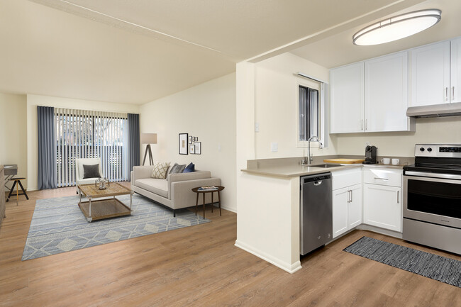 Renovated I kitchen and living room with hard surface flooring - eaves Warner Center