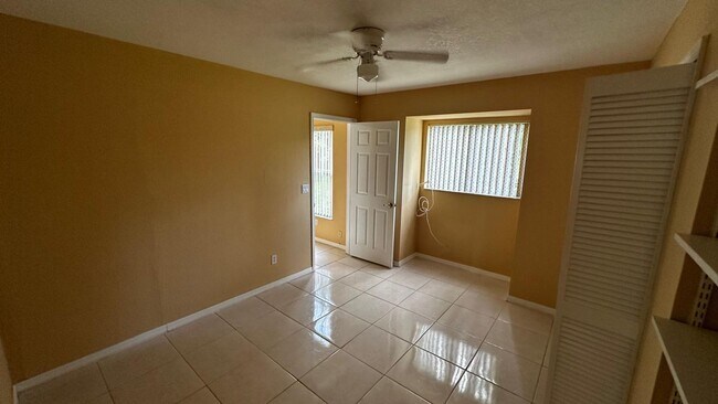 Building Photo - SPACIOUS 4-BEDROOM HOME WITH SCREENED POOL IN SE CAPE CORAL