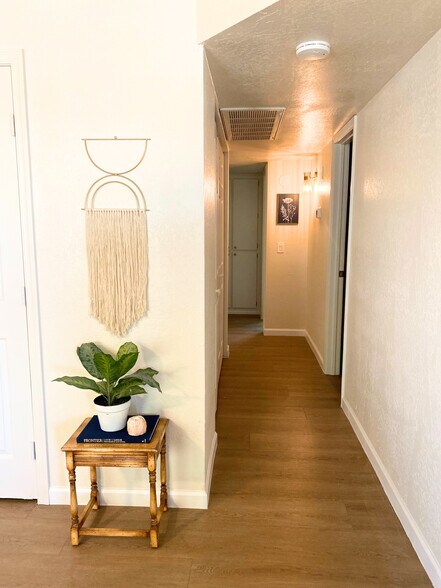 From living room into hall way and rooms. **Additional photos are on the way! We're currently in th - 1795 W 28th St