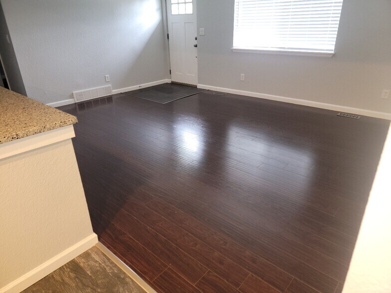Living room from eat in kitchen_laminate flooring - 8731 Field Way