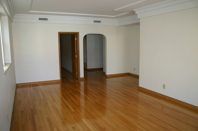 Living Room looking towards middle bedroom door and hallway to dining room. - 110 N 3rd St