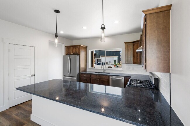 Building Photo - Lock-and-Leave Luxury Living — Lawn Care & Snow Removal Included!