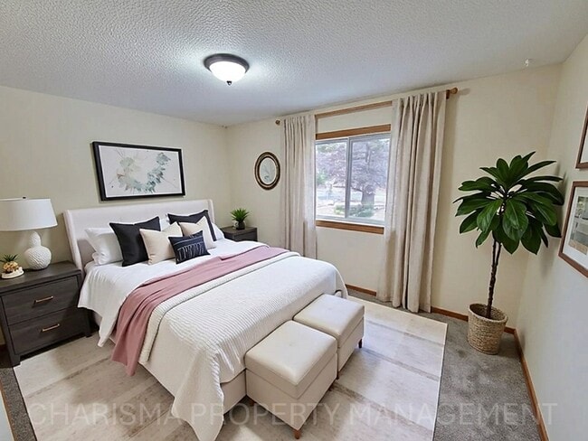 Building Photo - 4 BD, 2 BA - FENCED IN YARD, PRIVATE TRAILS, FINISHED UPPER AND LOWER LIVING AREAS, ATTACHED GARAGE!