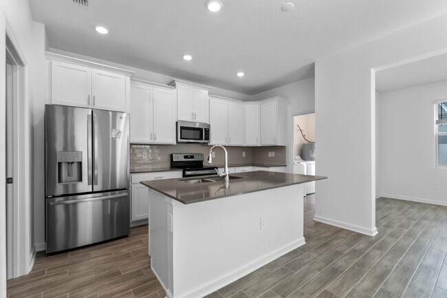 Building Photo - Modern Open-Concept Home with Designer Finishes and Community Amenities.