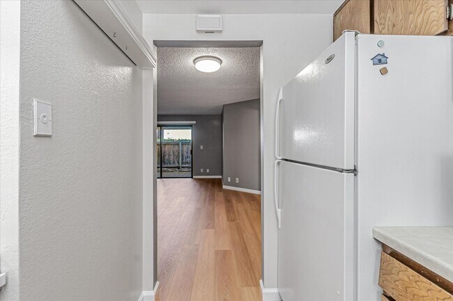 Building Photo - Stylish End-Unit Condo l Private Patio l Community Pool