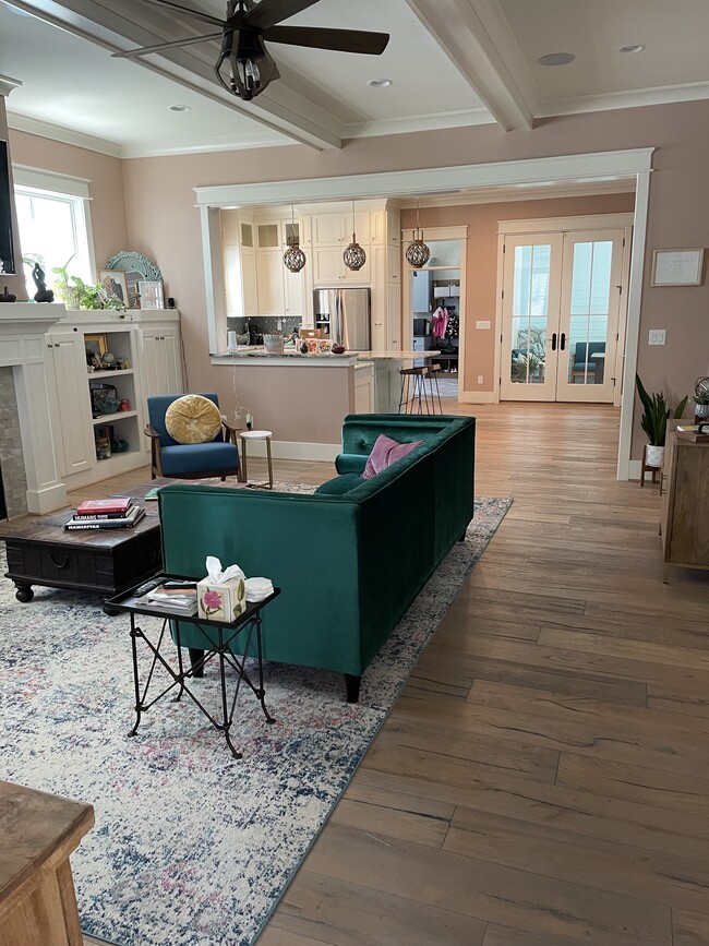 Living room into kitchen and mudroom - 4860 E Beach Dr