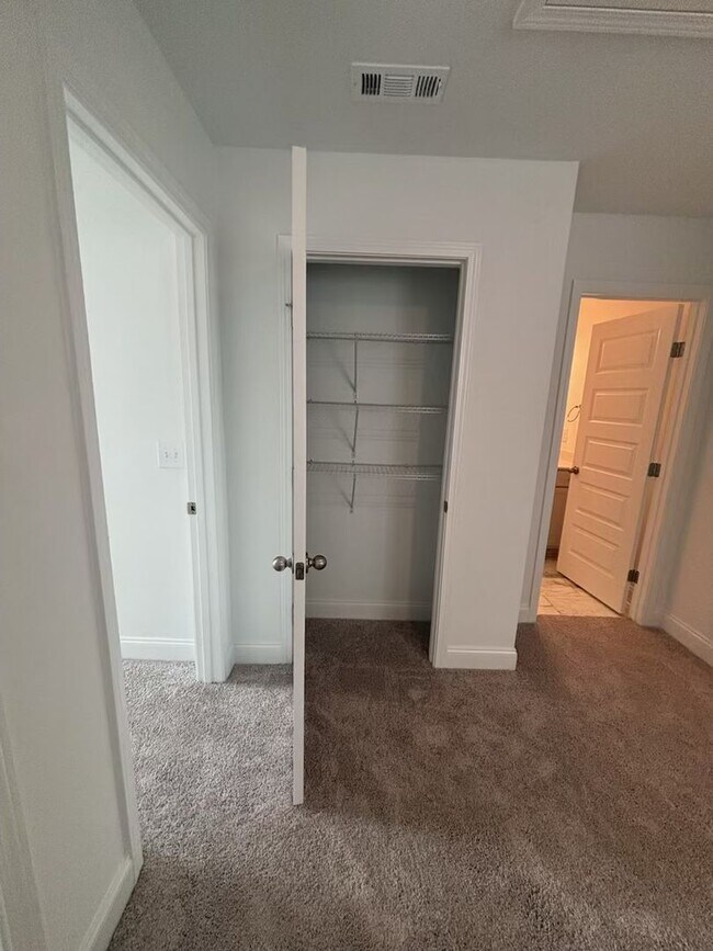 Building Photo - **BE THE LUCKY ONE TO LIVE IN THIS 2024-BUILT END-UNIT TOWNHOME IN A RESORT-STYLE COMMUNITY**