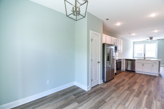 Building Photo - New END UNIT Townhome with Pond View and D...
