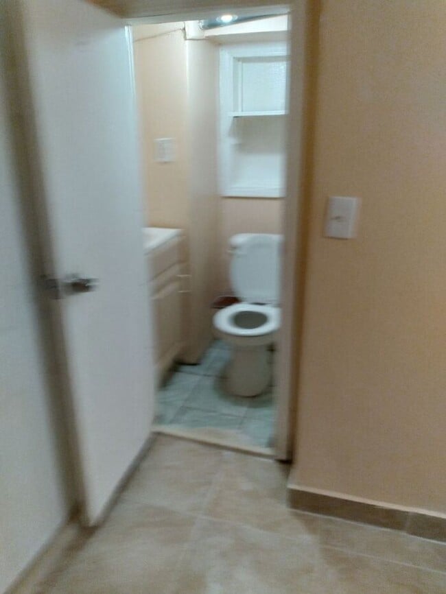 Building Photo - 3 bedrooms on the 3rd Floor with Central Hot Air, and an Available backyard