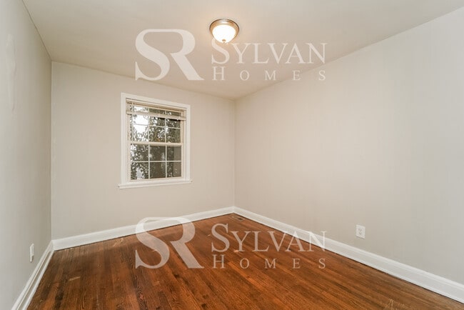 Building Photo - Welcome to this charming abode.
