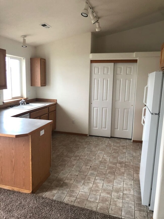 Building Photo - Newer Carpet, flooring & paint! 3 Bedroom 2 Bath with 2 car attached garage.