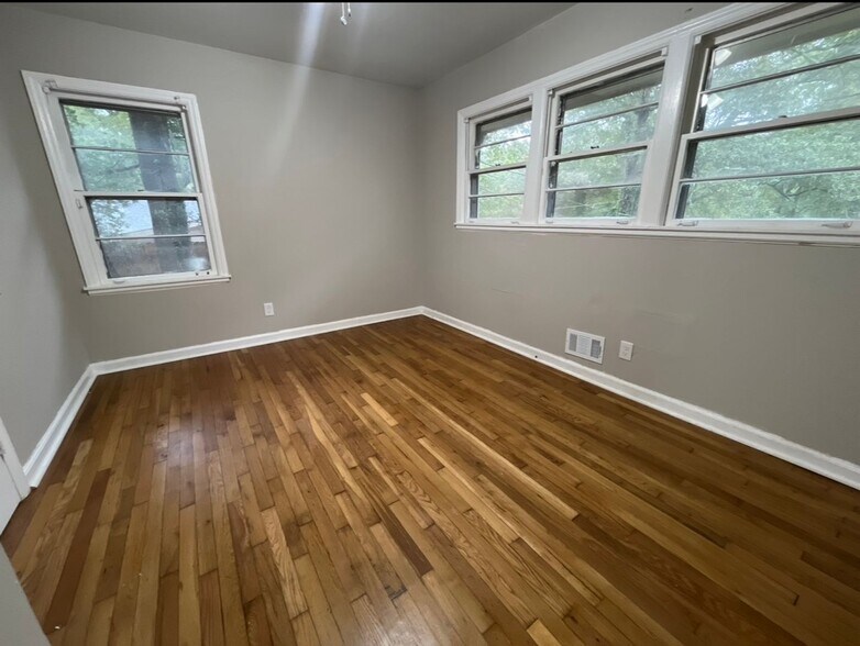 Building Photo - COMING SOON: Classic charm, peaceful living, your Forest Park retreat awaits in this spacious 3-b...