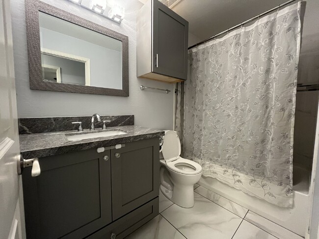 Building Photo - "Charming 4-Bed Oasis with Granite Touch & a Beautiful Pool"