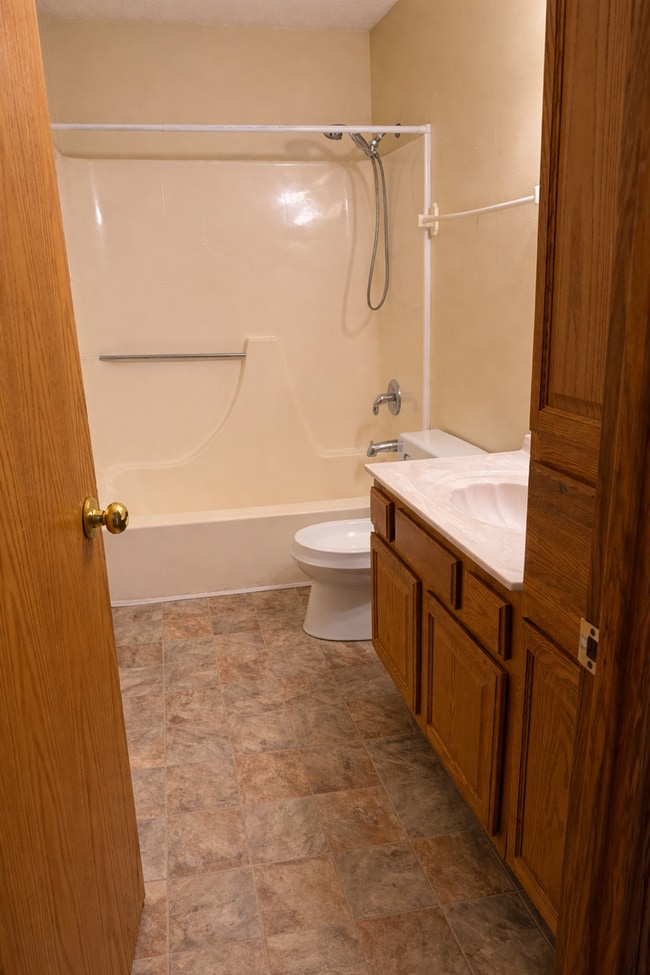 Building Photo - 4 BD, 2 BA - FENCED IN YARD, PRIVATE TRAILS, FINISHED UPPER AND LOWER LIVING AREAS, ATTACHED GARAGE!