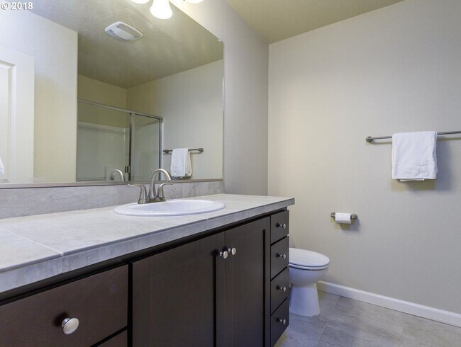 Building Photo - Neat and Tidy Newer Town Home with Two Master Bedrooms and Den on the Main Level