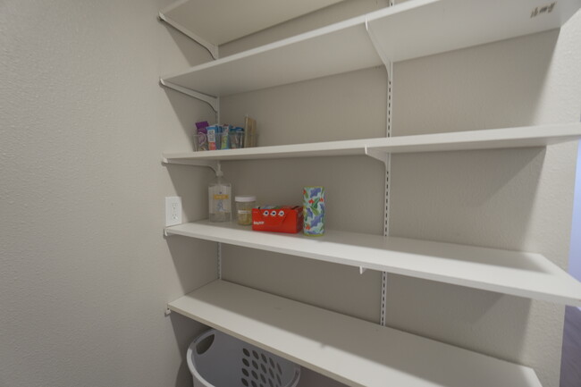 Shelving for pantry items and laundry supplies - 2708 Pin Oak Ln