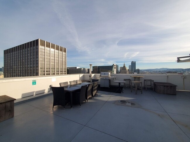 Building Photo - Downtown High-Rise Studio with parking and in-home laundry