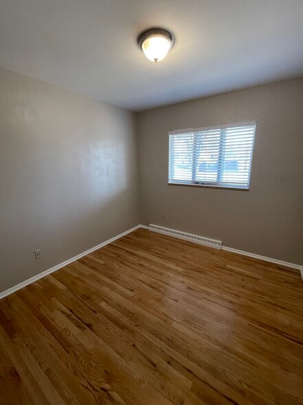 Upstairs bedrooms with hardwood floors - 7991 E Hampden Cir