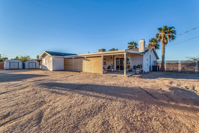 Building Photo - A Fully Furnished 3 Bedroom With Desert Mo...