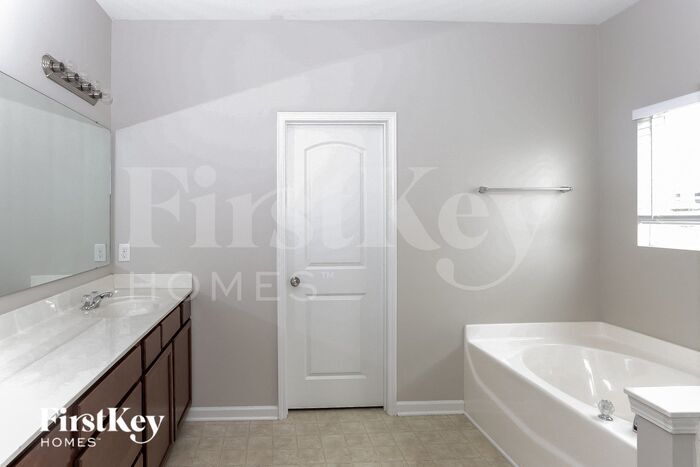 Building Photo - 6906 Barefoot Forest Dr