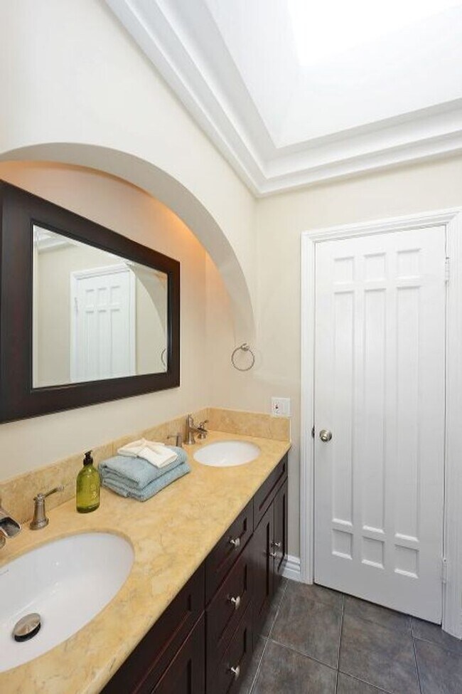 Building Photo - Welcome to this beautifully updated Spanis...
