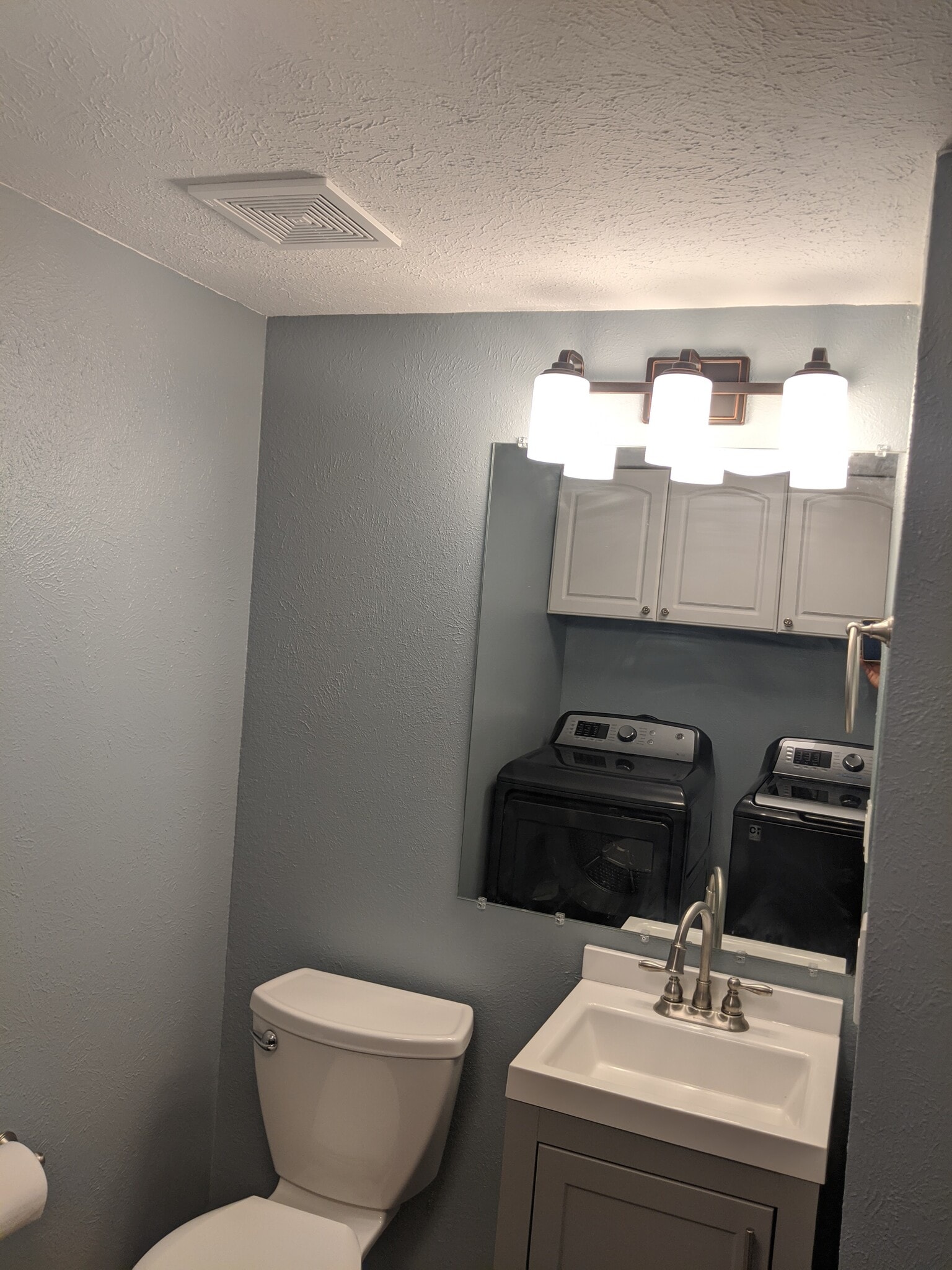 Main Level Bathroom &amp; Shared Laundry Room - 10230 W Jewell Ave