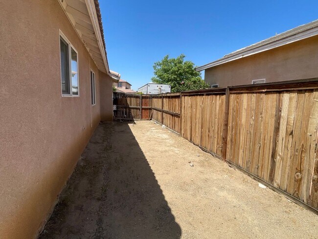 Building Photo - Adelanto Home-3 Bedrooms,2 Bathrooms, Laminate Floors, Indoor Laundry Room, Large Back Yard