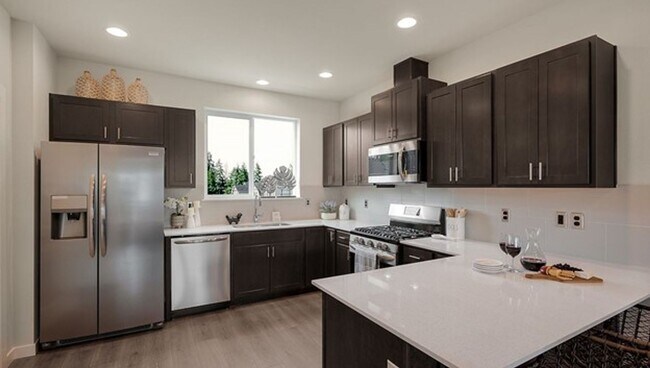 Building Photo - Spacious and Beautifully Landscaped Single...