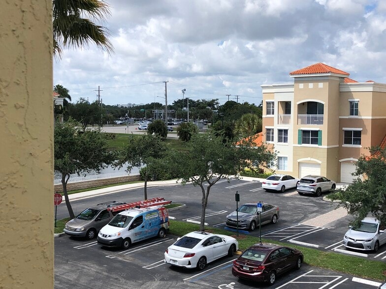 Parking lot. Building located next to pond - 11041 Legacy Blvd