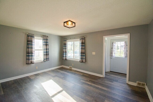 Building Photo - Fenced Yard, 2-Car Garage + Internet Included