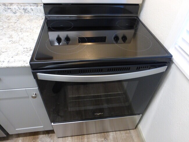 New electric glasstop stove - 215 8th St SE