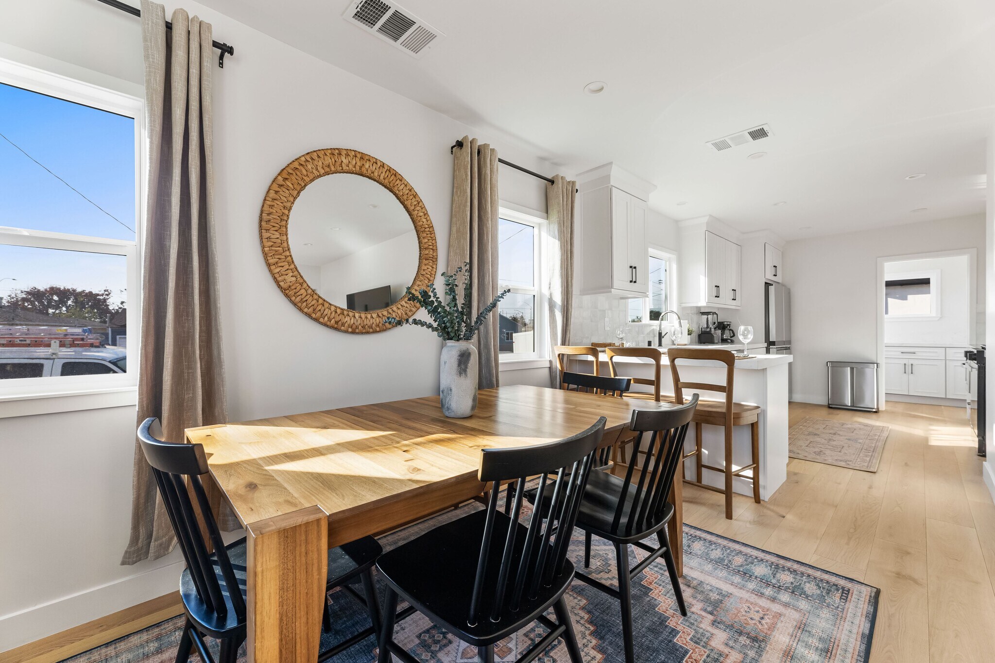 Dining area with West Elm furniture and decor. Table sits six and can expand to sit up to 8. - 1823 N Ditman Ave