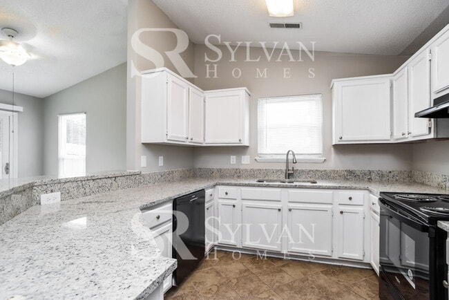 Building Photo - This home exudes a cheerful and welcoming ...