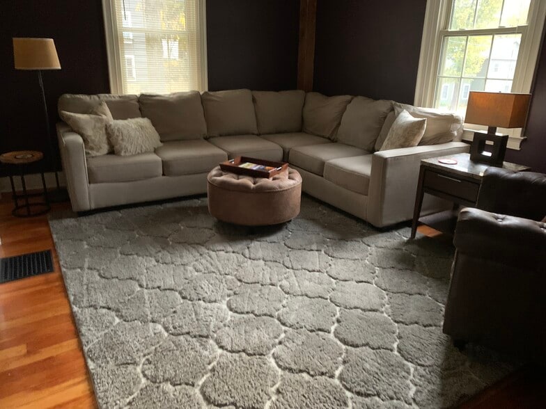 Comfy living room in relaxing neutral tones. air and ottoman. - 11 Kellogg St
