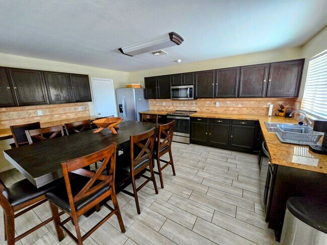 Building Photo - STUNNING 4 Bed, 2.5 Bath Oasis with Pool Your Dream Home Awaits!