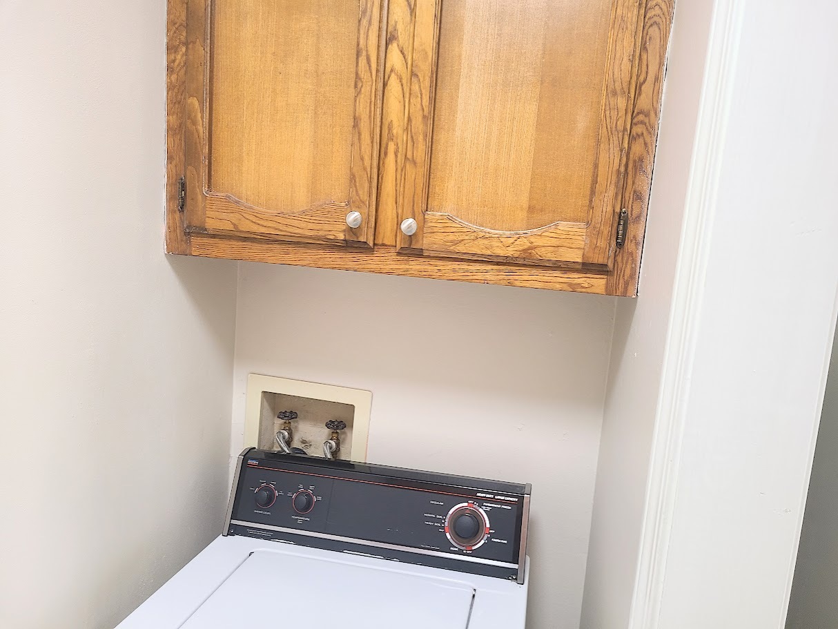 Laundry room with included washer and storage - 12439 Coursey Blvd
