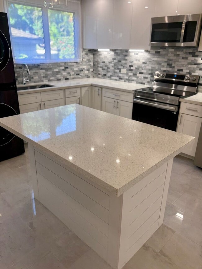 Primary Photo - Available Now | 2 Bedroom, 2 Bathroom Townhouse with 1 Assigned Parking Stall at Tropic Gardens 1