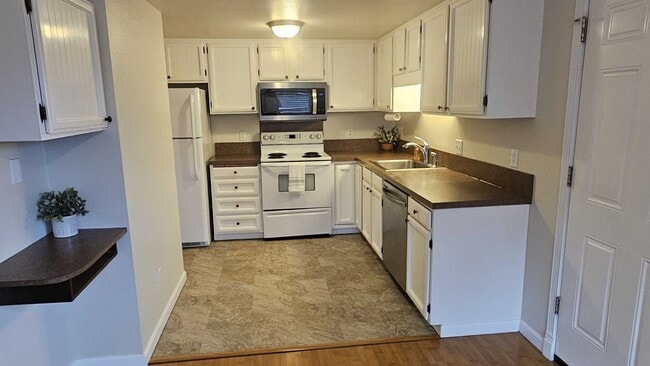 Building Photo - Charming updated 3 bed 1 bath ranch style home with double car garage and large fenced back yard.