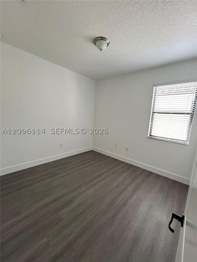 Building Photo - 9883 W 34th Ln
