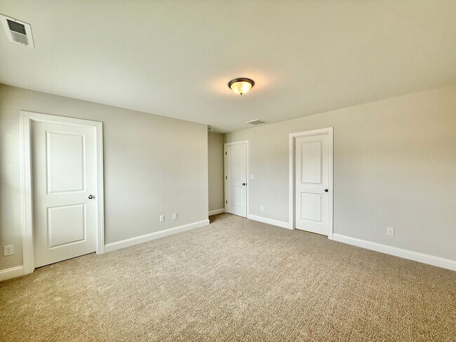 Building Photo - Stunning End Unit New Construction 3BD, 3....