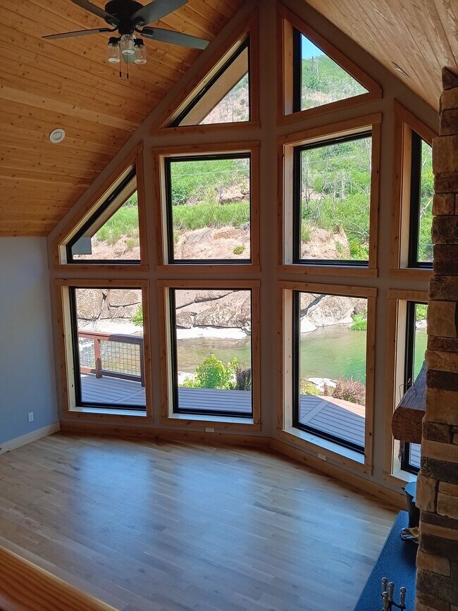 Building Photo - Beautiful Chalet Style Riverfront Property...