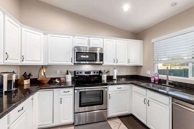 Building Photo - The Search is Over! 3-Bedroom, 2.5 baths with Refreshing Fenced Play Pool!