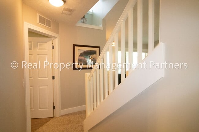 Building Photo - Spacious 3BR Townhome in Lowell | Nature Views & Maintenance-Free Living