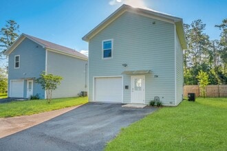 Building Photo - Modern Comfort Meets Prime Location — Stylish 2-Story Townhome