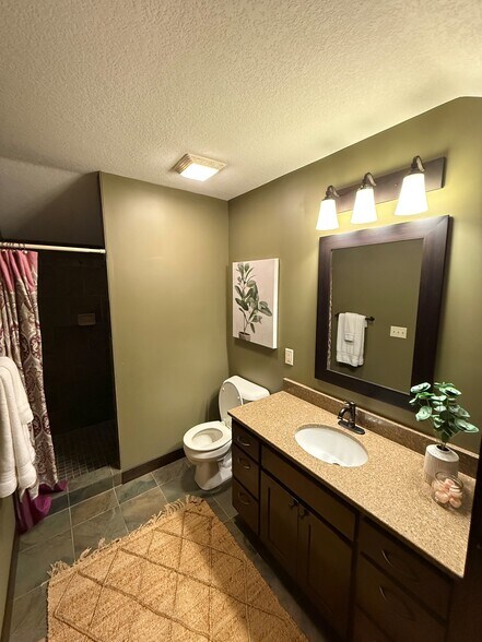 great bathroom with storage and walk in shower - 98 Tribute Ave