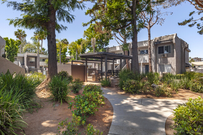 The vibrant greenery creates a serene atmosphere, making it a beautiful place to call home. - Scripps Poway Villas