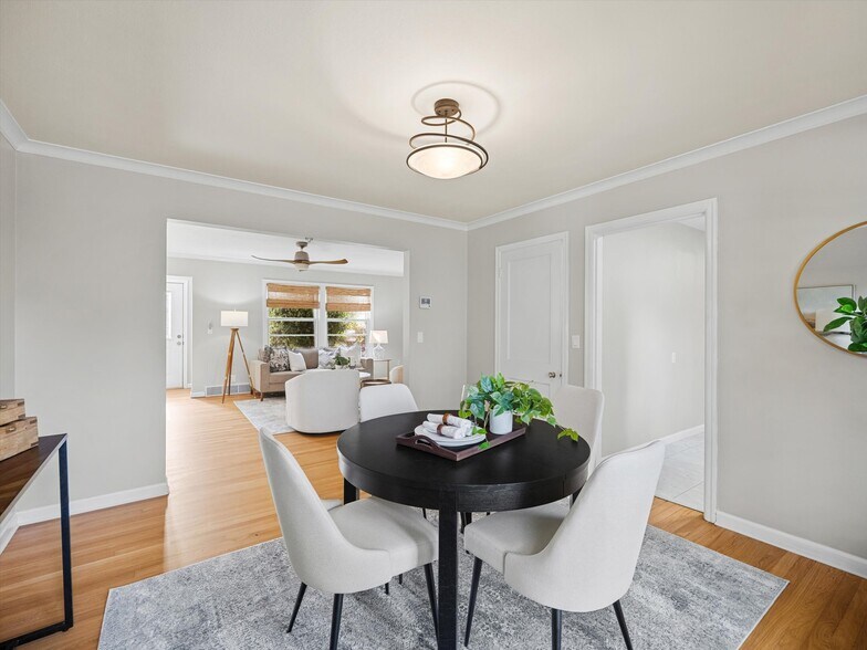 The dining room connects the living room and the kitchen. - 9835 SW 80th Ave