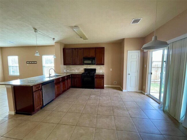 Building Photo - 10803 Woodwind Shadows Dr