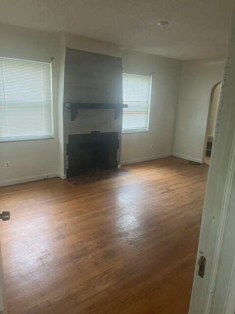 Living room with fireplace - 15205 Maplewood Ave