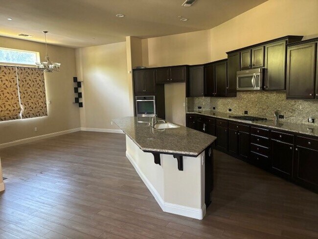 Building Photo - Elegant 4-Bedroom Home with Paid Solar in ...